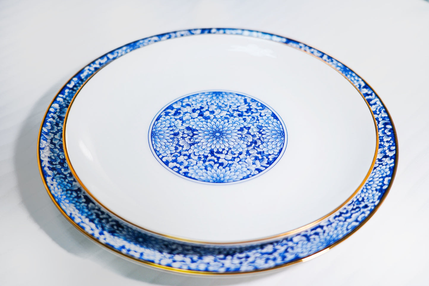 Gold-trimmed Blue and White Porcelain Dinnerware (4 pieces)